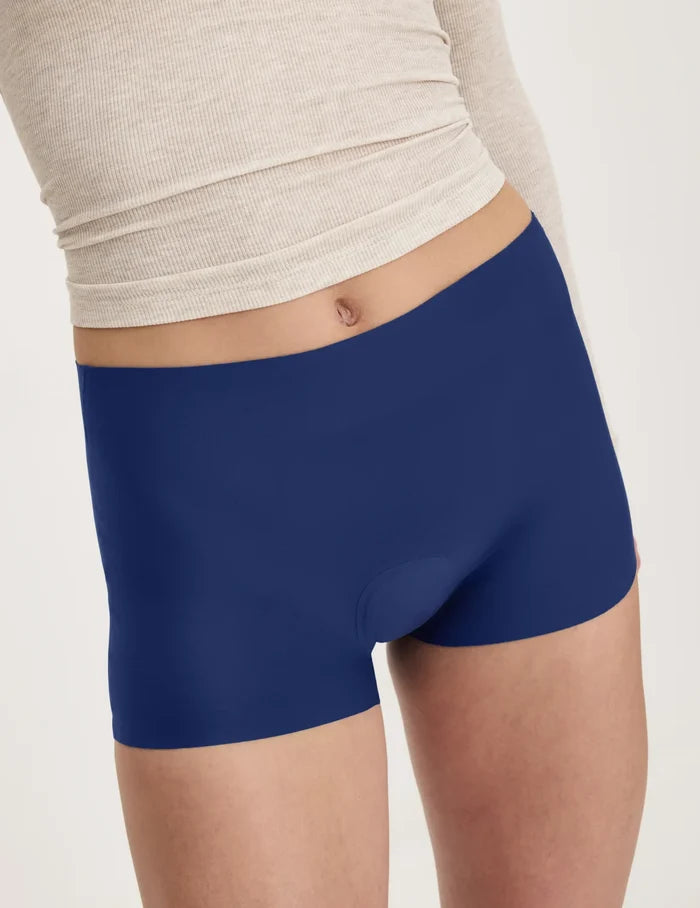 | Front view of model wearing the Teen Super Leakproof® Sleepover Short highlighting the coverage and smooth fit | Night Sky