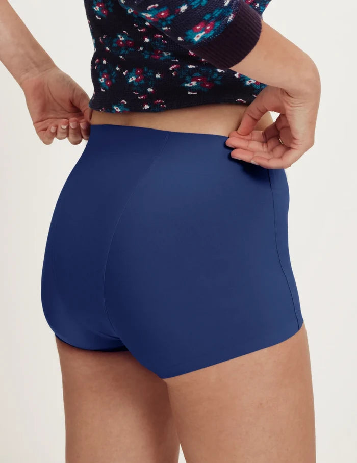 | Front view of model wearing the Teen SuperPlus Leakproof® Sleepover Short highlighting the coverage and smooth fit | Night Sky