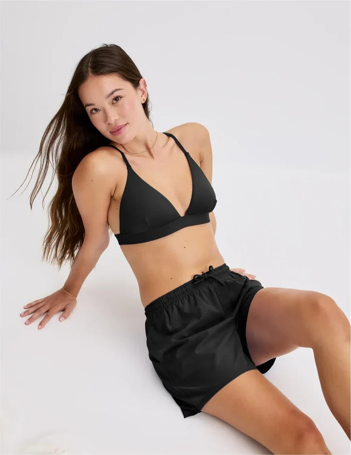 | Front view of model wearing the Teen Triangle Bikini Top highlighting the neckline, strap design and fit | Black
