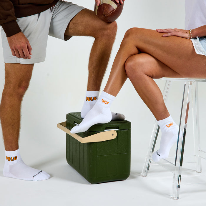 Two models wearing Del Campo Tennessee Block golf socks in studio
