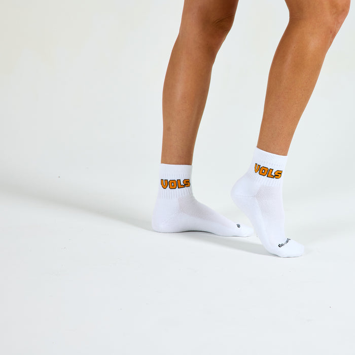 Woman wearing Del Campo Tennessee Block golf socks, studio shot, no shoes