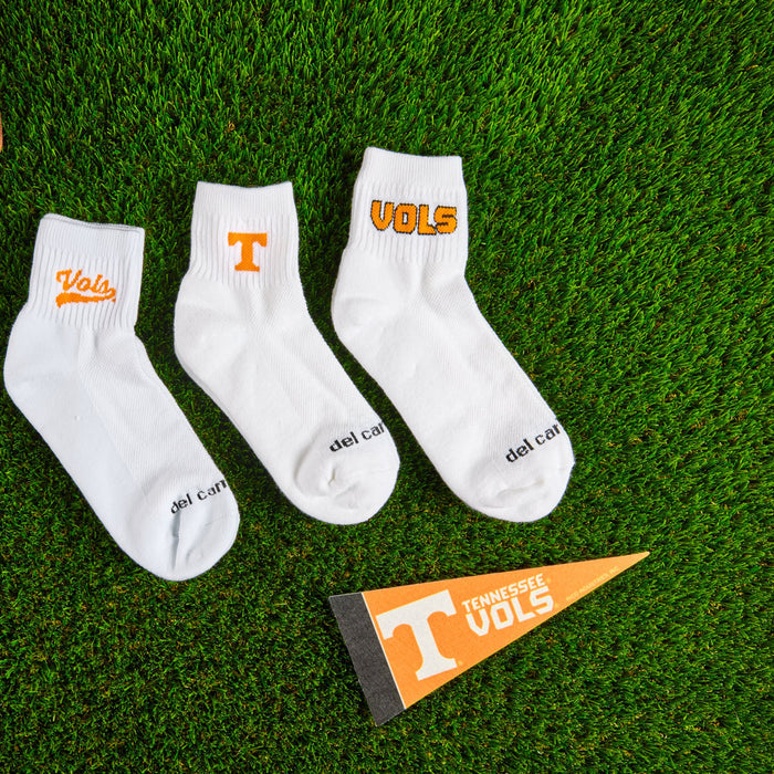 Del Campo Tennessee Pack golf socks styled on turf beside a pennant