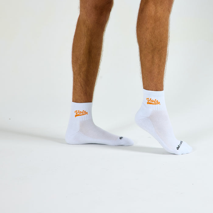 Man wearing Del Campo Tennessee Script golf socks, studio shot, no shoes