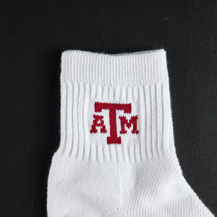 Close-up of the maroon ATM interlock on Del Campo Texas A&M Aggies golf socks