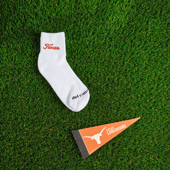 Del Campo Texas Longhorns Script golf socks on turf with a team pennant