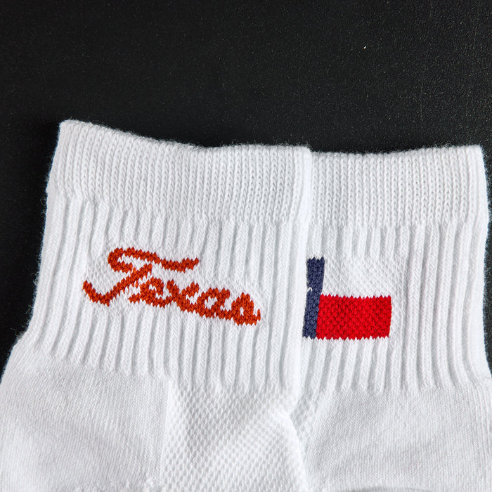 Close-up of the burnt orange Texas script wordmark on Del Campo Texas Longhorns Script golf socks