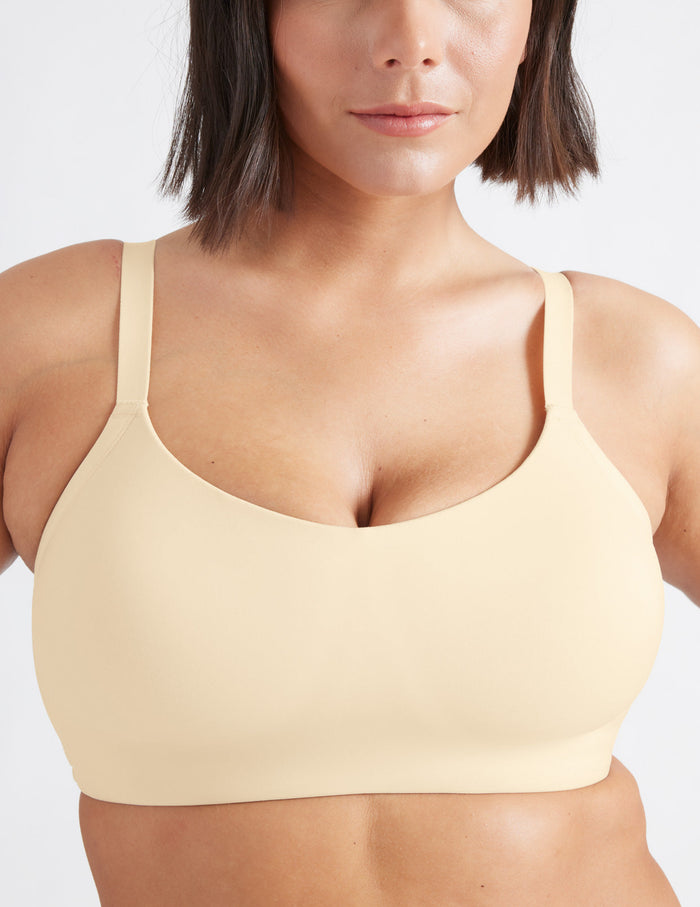 Maya is a 34F and wearing KNIX M++ | Front view of model wearing the One&Only Scoop Bra®, highlighting the neckline, strap design, and  silhouette | Dune