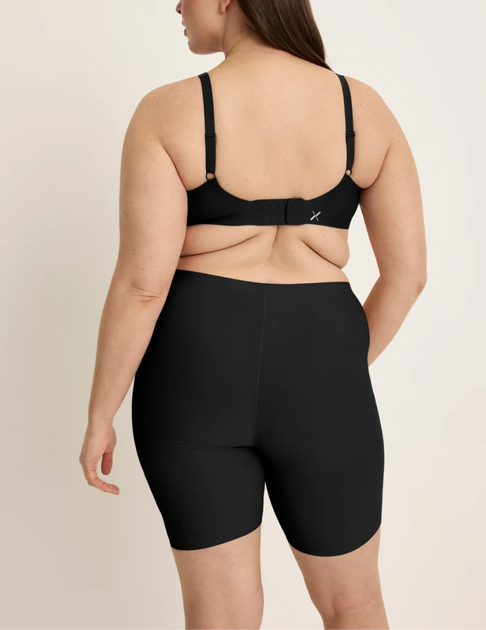 Beatrice is wearing KNIX XL | Back view of model wearing the Thigh Saver® 6” highlighting the coverage and smooth fit | Black