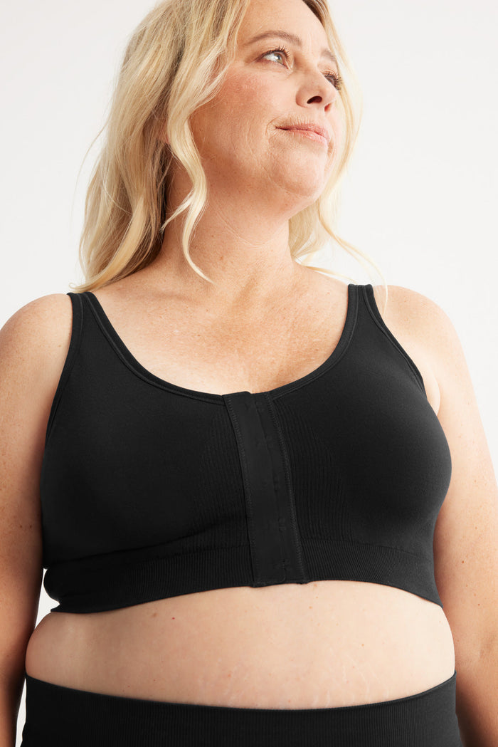 Kimberly is a customer and wears a Knix size L | Front view of model wearing the Ultra Soft Front Closure Bra, highlighting the neckline, easy front closure, and seamless knit silhouette | Black