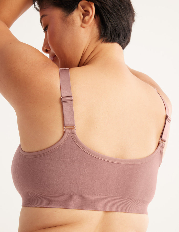 Denise is a customer and wears a Knix size M | Back view of model wearing the Ultra Soft Front Closure Bra, highlighting the neckline, easy front closure, and seamless knit silhouette| Bisque