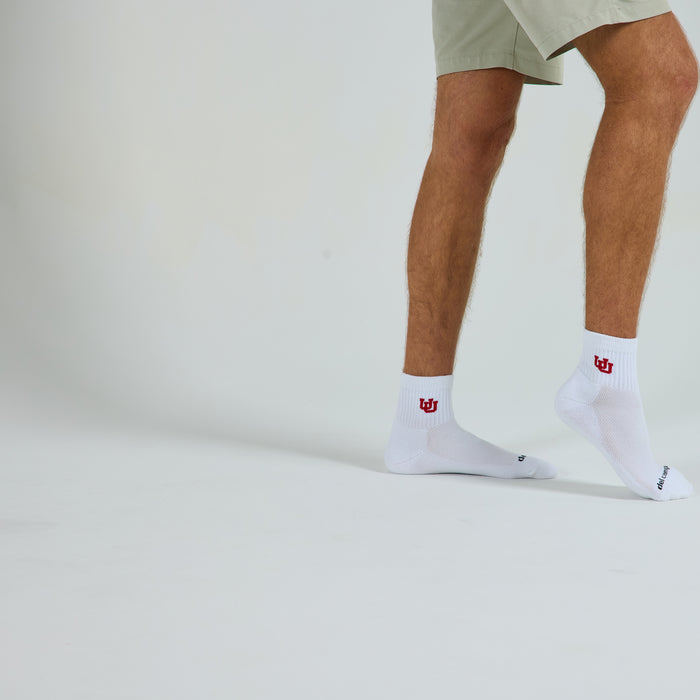 Del Campo Utah Utes golf socks on a male model in studio