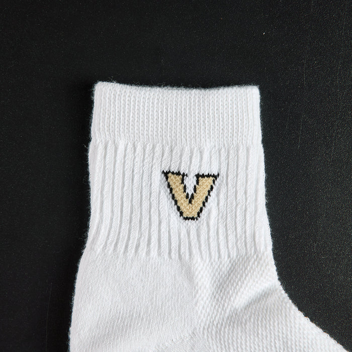 Close-up of the gold V with black outline on Del Campo Vanderbilt Commodores golf socks