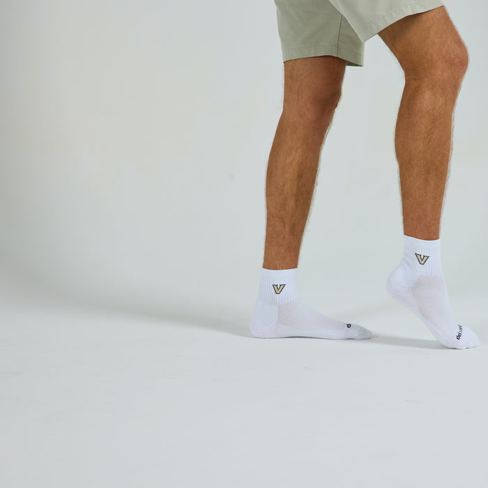 Man wearing Del Campo Vanderbilt Commodores golf socks, studio shot, no shoes