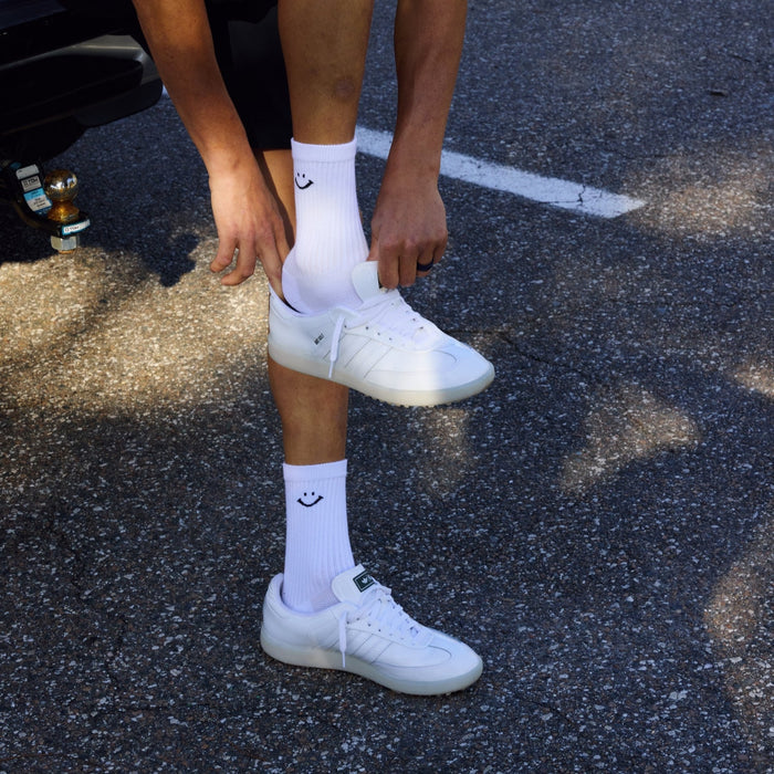 Del Campo Variety Crew 3-Pack golf socks featuring one grey stripe, one blank, and one smiley crew sock