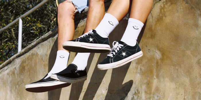 Del Campo Variety Crew 3-Pack golf socks featuring one grey stripe, one blank, and one smiley crew sock