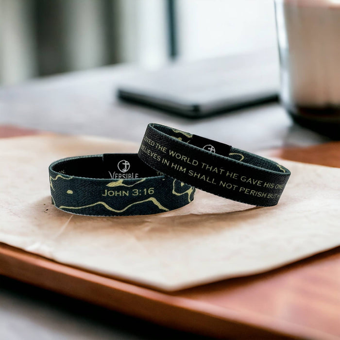 FOR GOD SO LOVED THE WORLD, THAT HE GAVE HIS ONE AND ONLY SON, THAT WHOEVER BELIEVES IN HIM SHOULD NOT PERISH, BUT HAVE ETERNAL LIFE. JOHN 3:16 The greatest treasure ever offered to mankind is featured on our Gold Vein Wristband. With a striking gold and black topography pattern on one side, the other side is emblazoned with John 3:16 – revealing the ultimate expression of God’s love for a lost world. * Reversible Design * Outside: Black with Gold Topography * Inside: John 3:16 on Black * Soft,