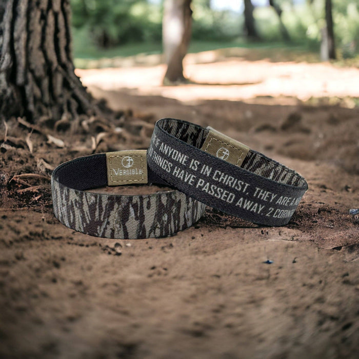 THEREFORE IF ANYONE IS IN CHRIST, THEY ARE A NEW CREATION. THE OLD THINGS HAVE PASSED AWAY. 2 CORINTHIANS 5:17 With 2 Corinthians 5:17 on dark brown on one side, and a brown and tan tree bark camo pattern on the other, this design serves as a reminder that in Christ we are made new! * Outside: Brown &amp; Tan Tree Bark Camo * Inside: 2 Corinthians 5:17 on Dark Brown * Soft, Stretchy Polyester / Elastic Blend * Stretch to Fit - Size Guide in Photo Gallery * Washable: Cold Water / Air Dry * Includ