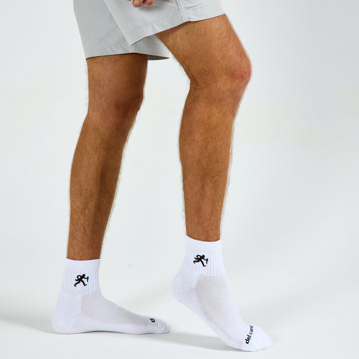 Man wearing Del Campo Wake Forest Walking Deacon golf socks, studio shot, no shoes
