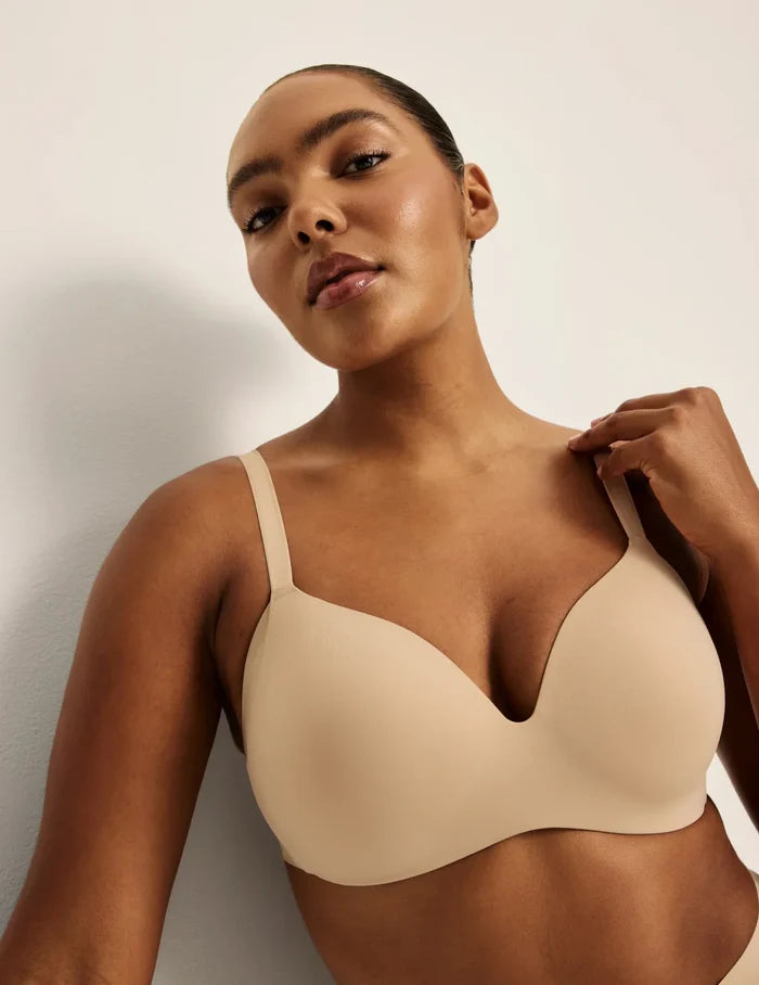 Amber is wearing a 36C | Front view of model wearing the WingWoman Contour Bra, highlighting the neckline, strap design, and  silhouette | Warm Sand